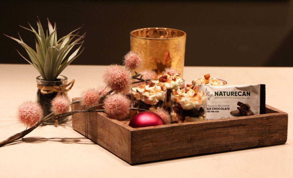 a wooden box filled with assorted items on top of a table.