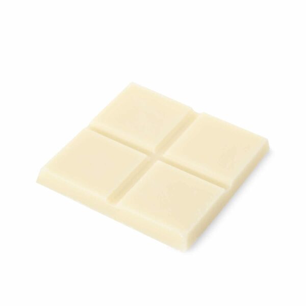 A piece of CBD white chocolate on a white background.