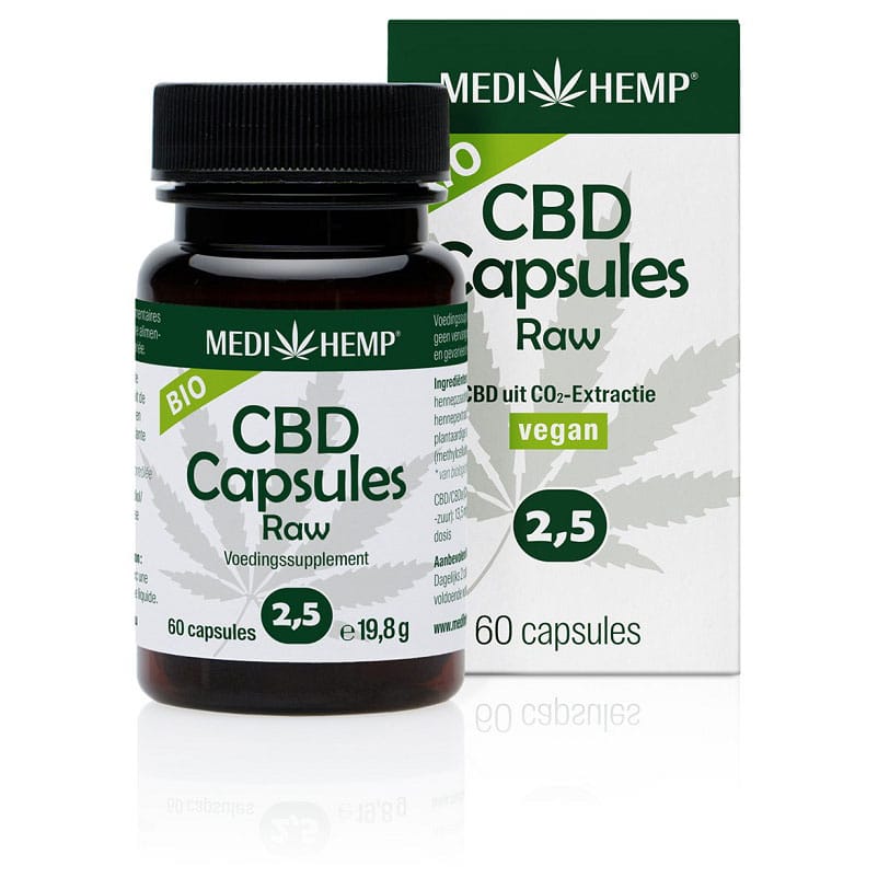 a bottle of cbd capsules next to a box of cbd capsules.