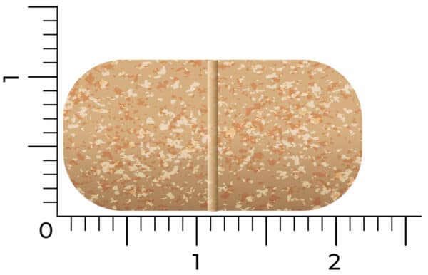 A brown, speckled oblong tablet of Vitakruid – Multi Day & Night® Mama (2 x 30 Tablets) is displayed on a scale, measuring approximately 2 centimeters wide and 1 centimeter tall.