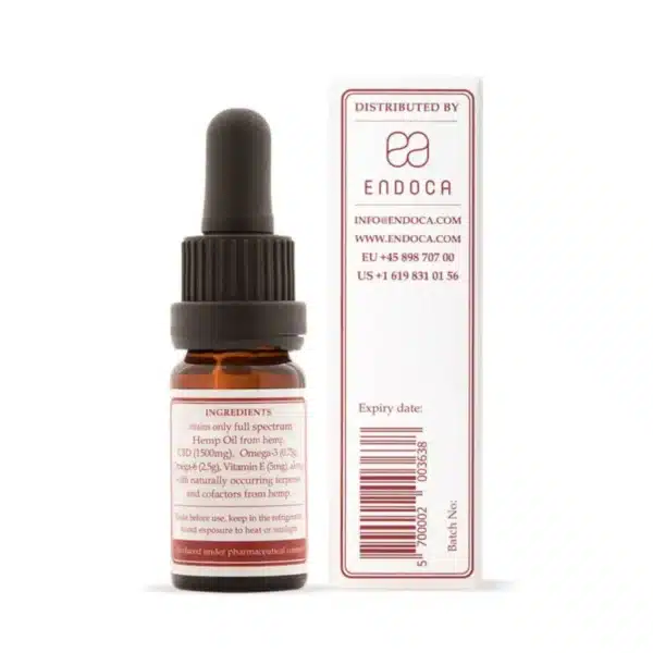 A small brown dropper bottle labeled "Endoca - Decarb 15% CBD oil (10ml) - mild taste" stands next to its white box, showing contact info, ingredients, and expiry date on the label.